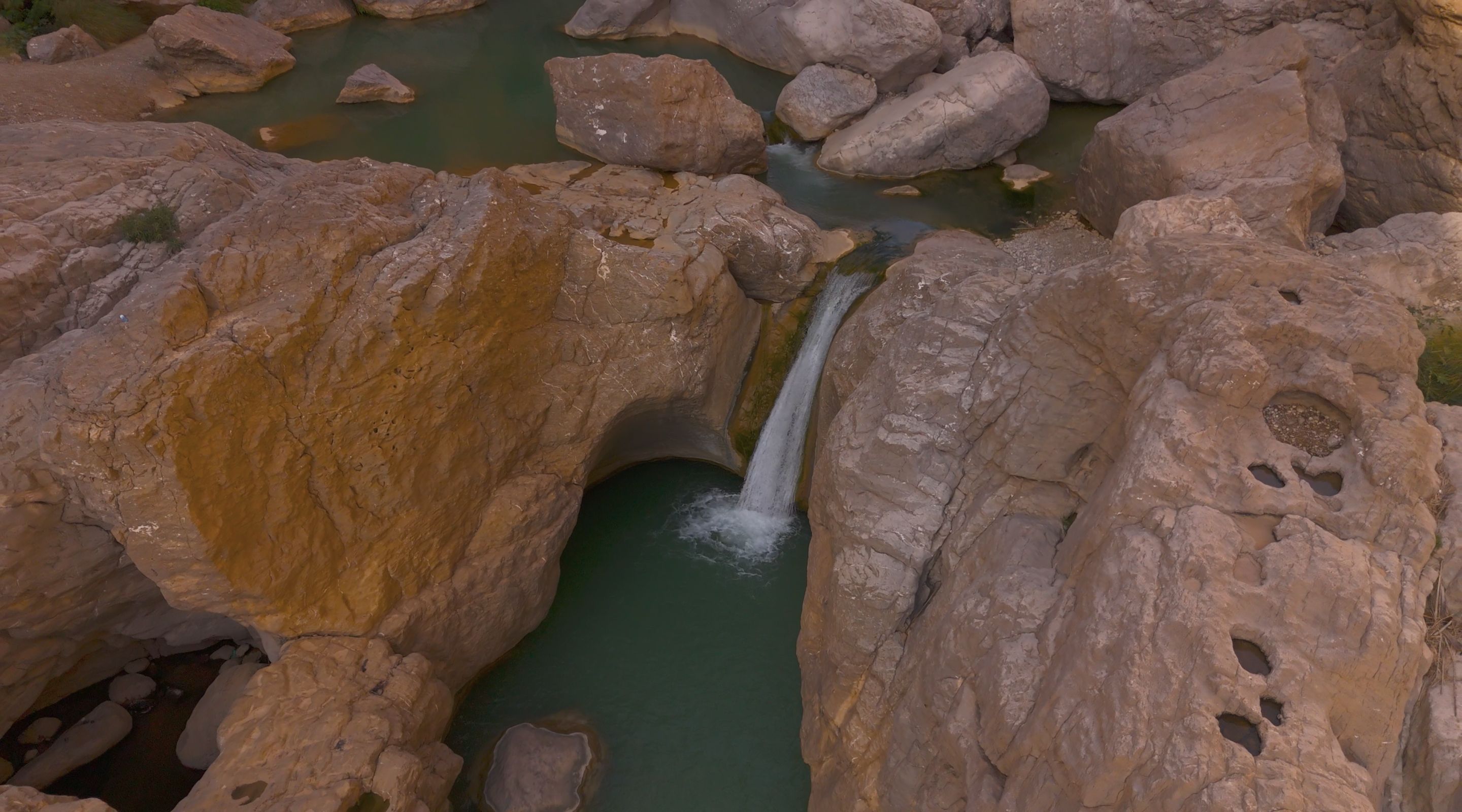 a waterfall flowing over rocks